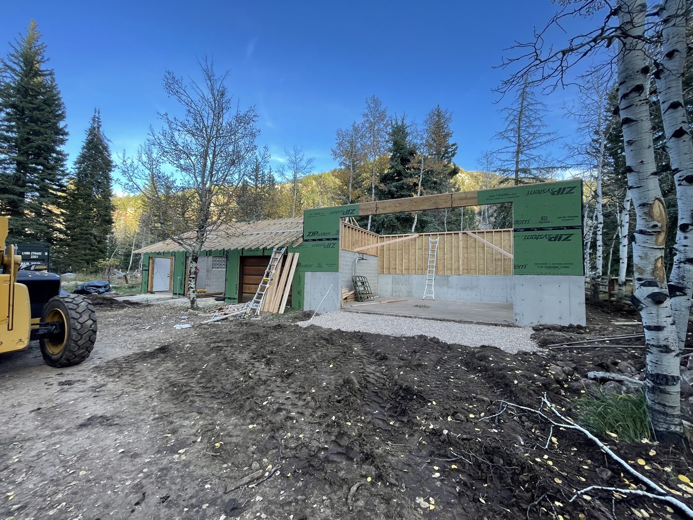 Framing: garage walls going up at a mountain cabin