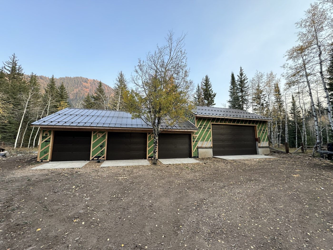 Dried-in: sheathed garage with metal roof and doors installed