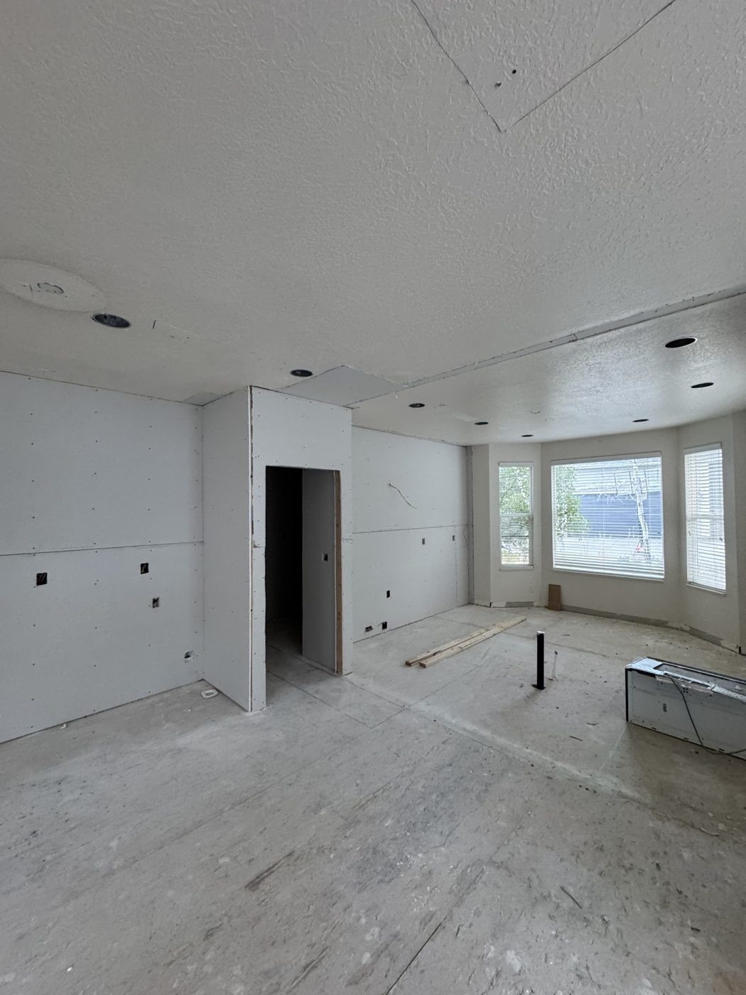 During: kitchen gutted to fresh drywall