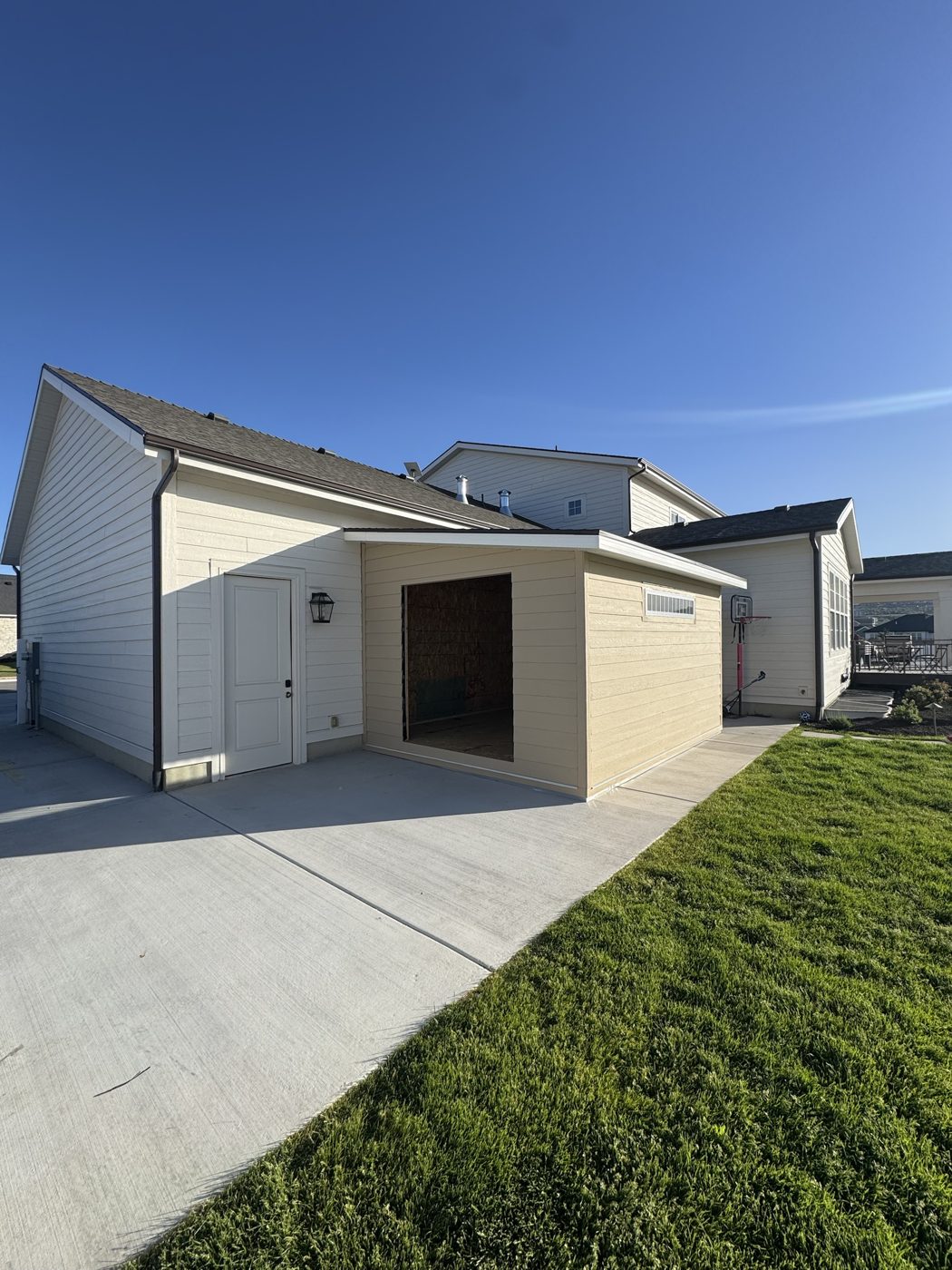 After: new storage addition with siding matched to the house