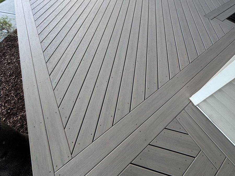 Gray composite deck with picture-frame border and diagonal decking