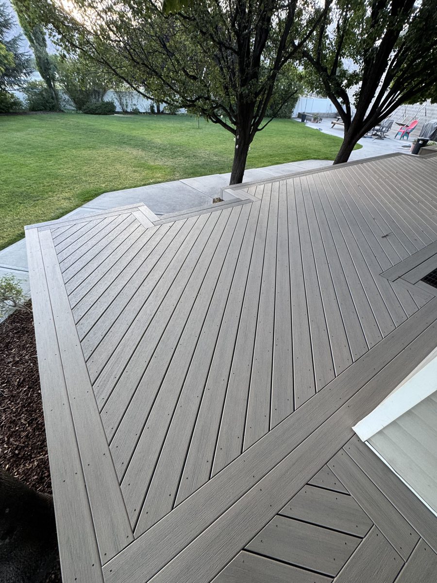 Gray composite deck with picture-frame border and diagonal decking