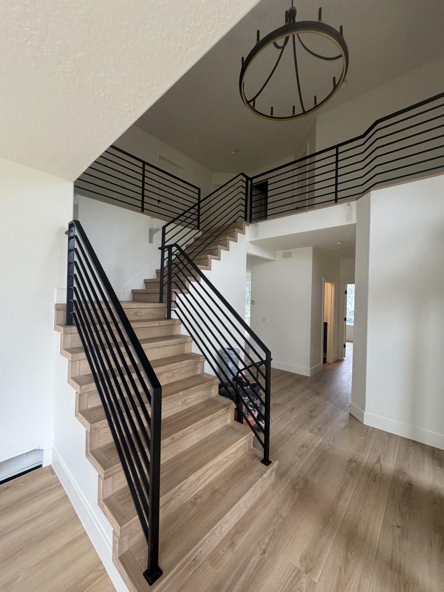 Custom steel stair and balcony railing, fabricated in-house